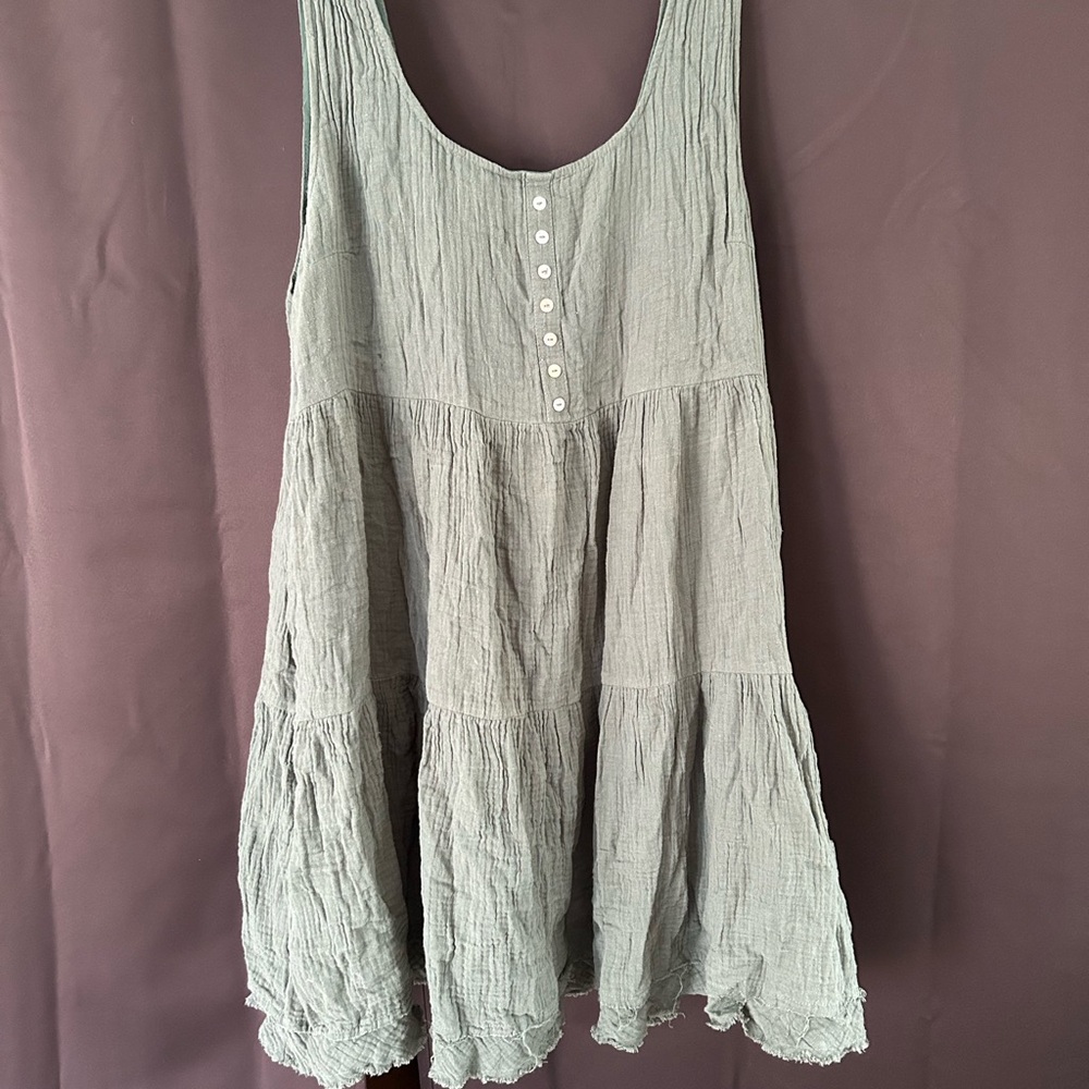 Entro Green  Sleeveless dress dress is a darker green.